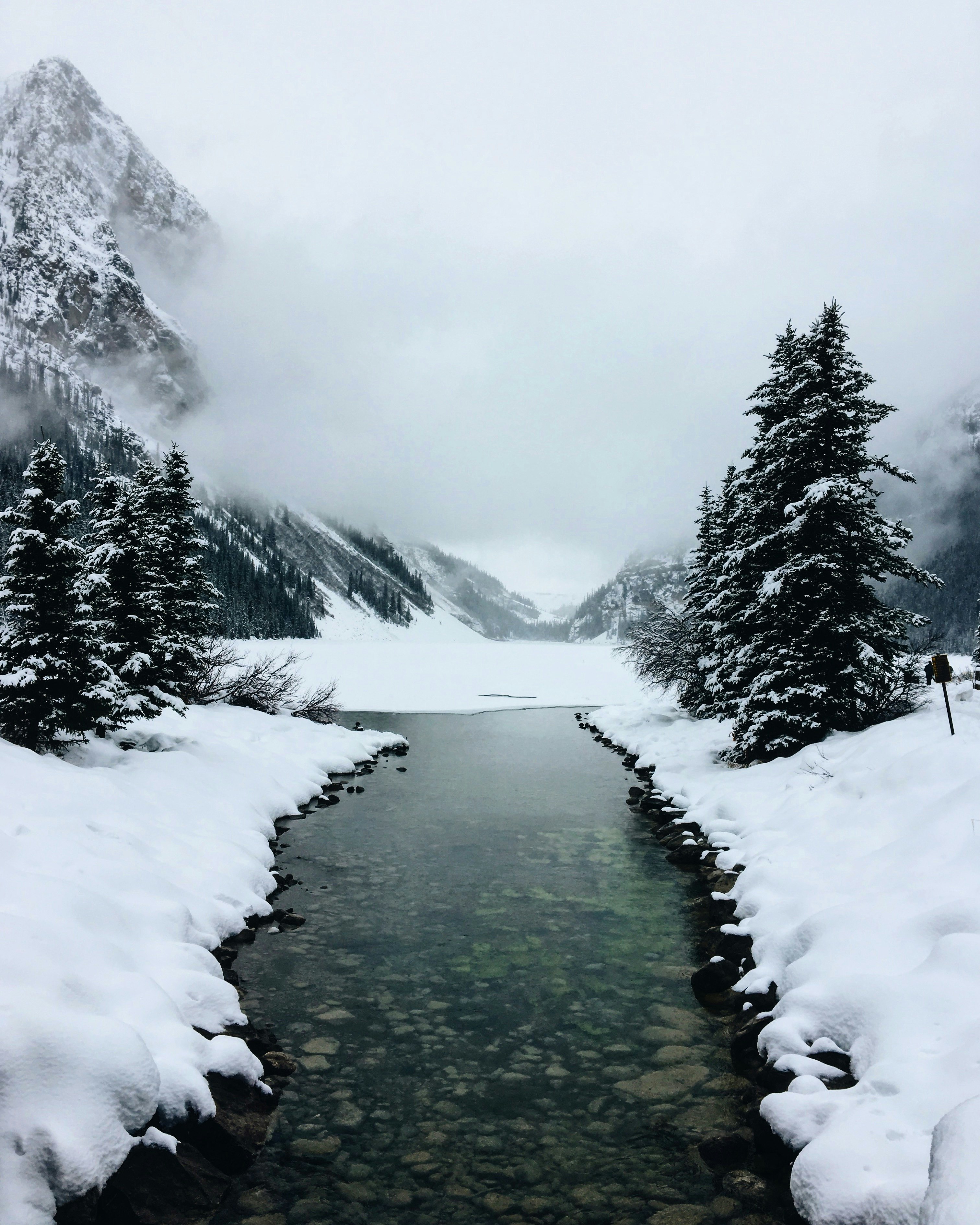 river at glacier mountain with fogs